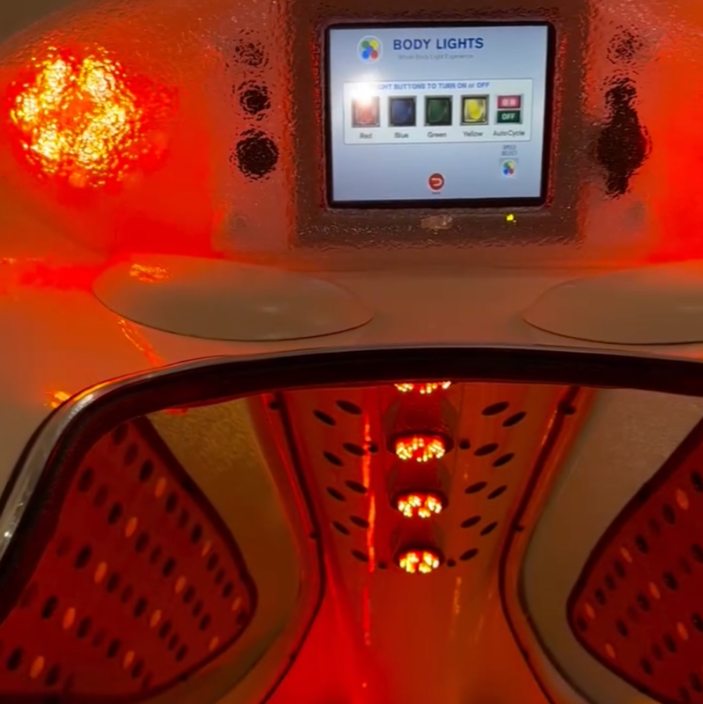 Infrared sauna with digital display and red light therapy.